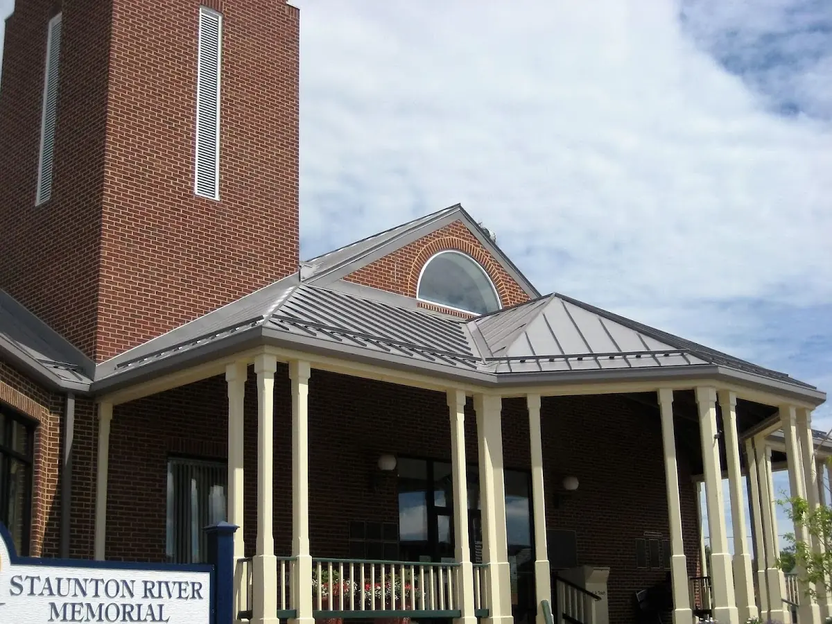 Skilled roofing craftsmen working on a residential roof in Hickory Hill